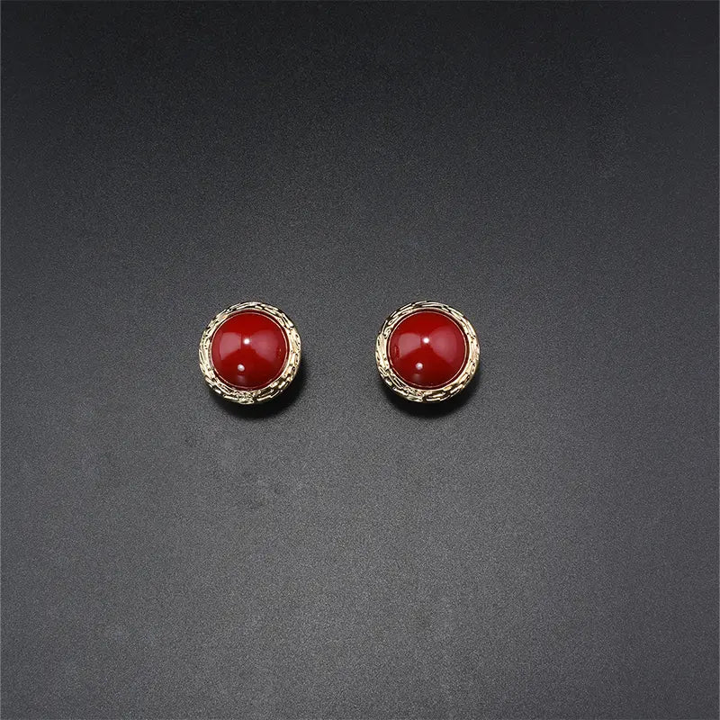 Parure de bijoux élégante en pierre rouge et pampilles dorées pour dîners de gala