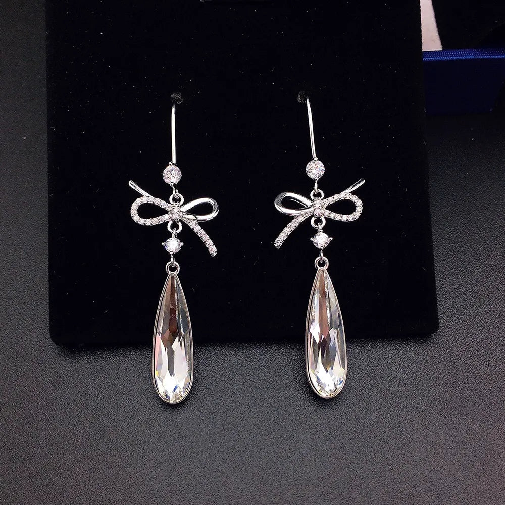 Boucles d'oreilles pendantes de luxe en cristal bleu en forme de nœud pour femme