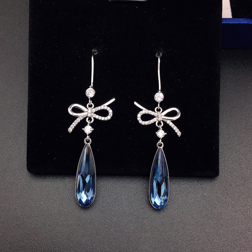 Boucles d'oreilles pendantes de luxe en cristal bleu en forme de nœud pour femme