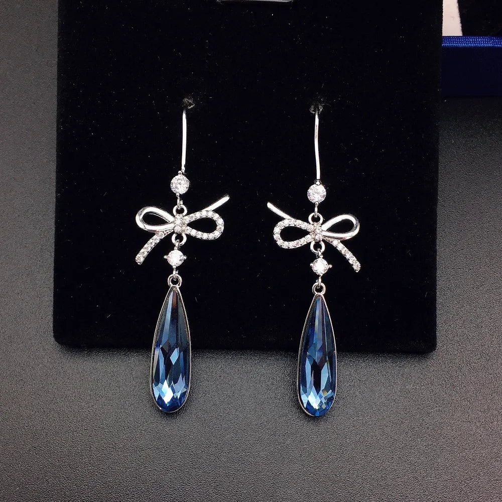 Boucles d'oreilles pendantes de luxe en cristal bleu en forme de nœud pour femme