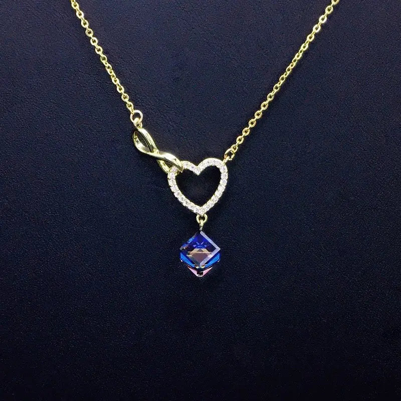Collier Cœur Infini Or Scintillant avec Goutte Cristal Bleu pour Rendez-vous Romantiques