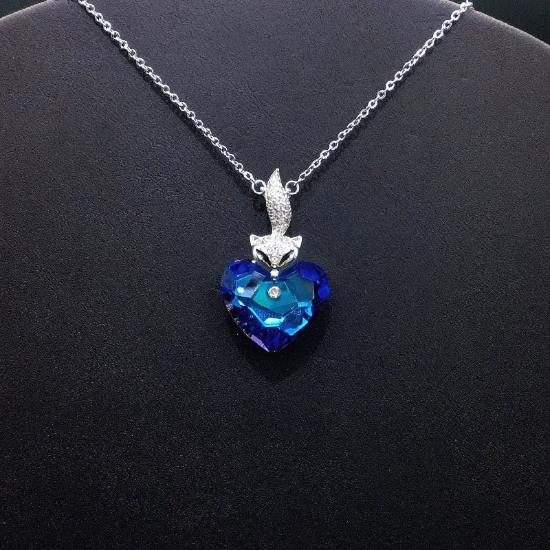 Élégant Renard Argenté - Collier Cœur avec Cristal Bleu Profond pour Galas Formels