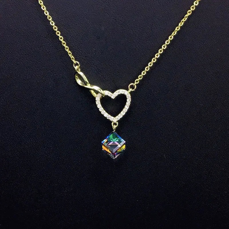 Collier Cœur Infini Or Scintillant avec Goutte Cristal Bleu pour Rendez-vous Romantiques