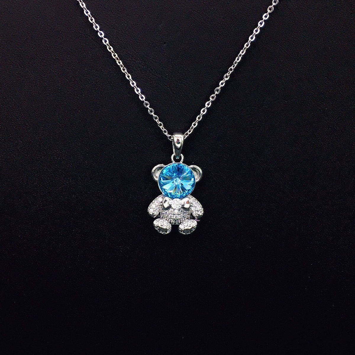 Delicate Gold Teddy Bear Necklace with Sparkling Blue Crystal as a Sweet Gift