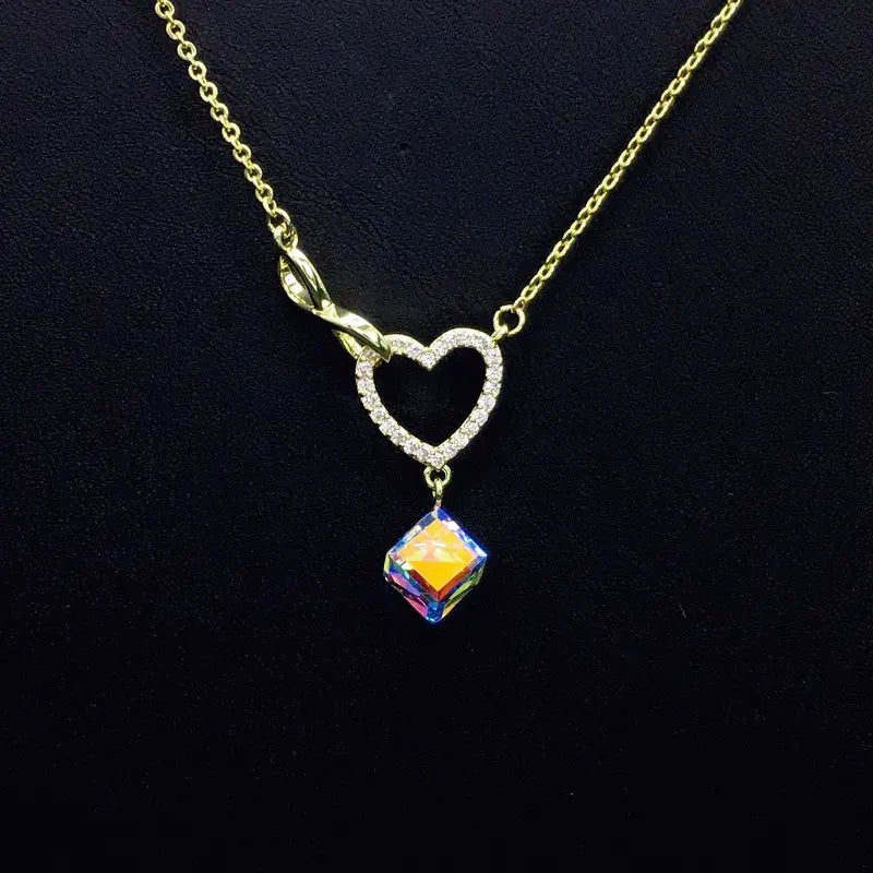 Collier Cœur Infini Or Scintillant avec Goutte Cristal Bleu pour Rendez-vous Romantiques