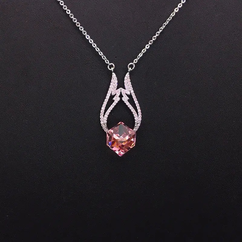 Collier pendentif glamour en cristal bleu avec ornements argentés pour les soirées