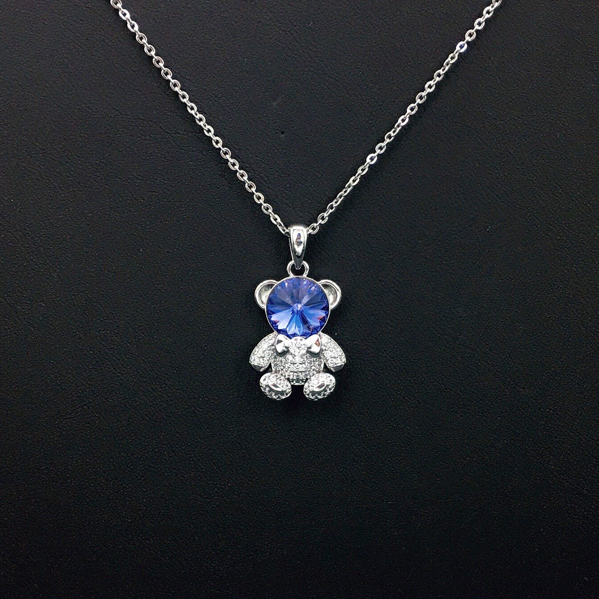 Delicate Gold Teddy Bear Necklace with Sparkling Blue Crystal as a Sweet Gift