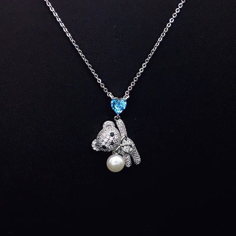 Collier Ours en Peluche Scintillant avec Cristal Cœur Bleu et Perle pour Rendez-vous Romantiques