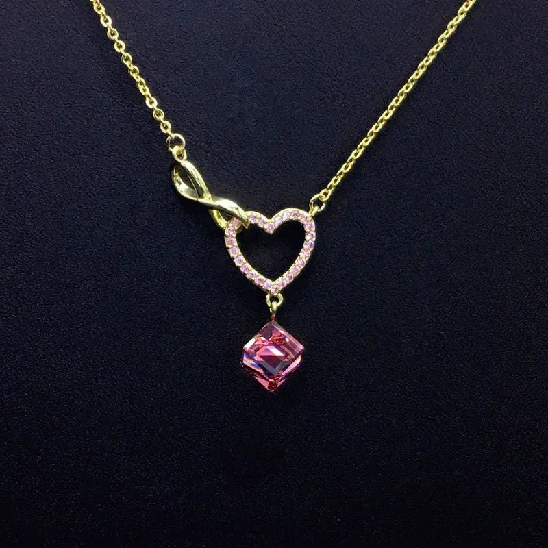 Collier Cœur Infini Or Scintillant avec Goutte Cristal Bleu pour Rendez-vous Romantiques