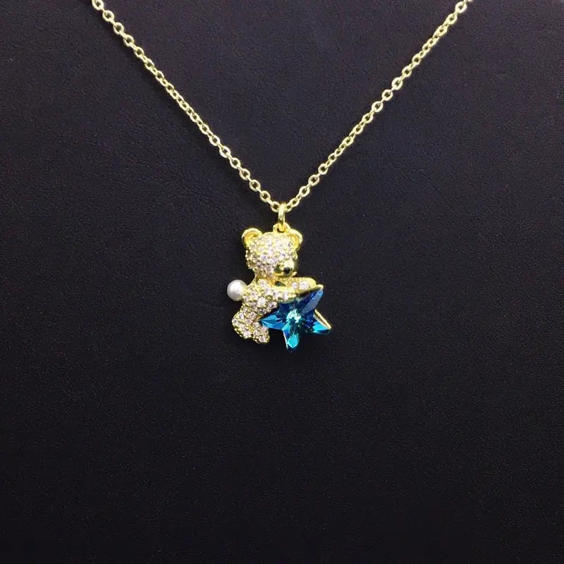 Collier Ours en Peluche Doré avec Cristal Étoile Bleue et Perle – Une Idée Cadeau Attentionnée