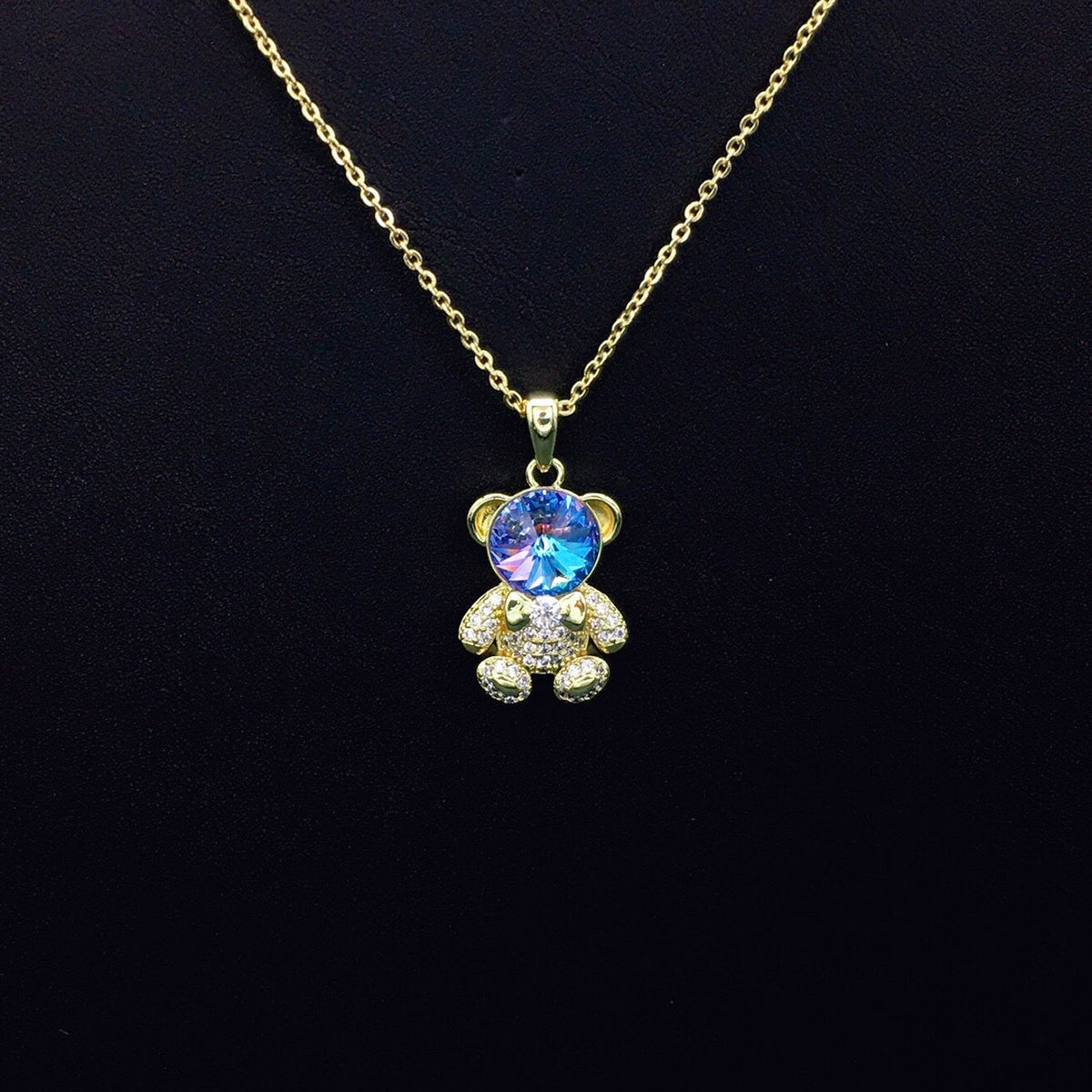 Delicate Gold Teddy Bear Necklace with Sparkling Blue Crystal as a Sweet Gift