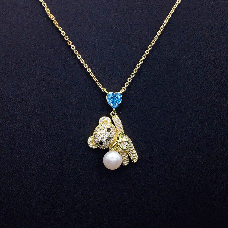 Sparkling Teddy Bear Necklace with Blue Heart Crystal & Pearl for Romantic Dates
