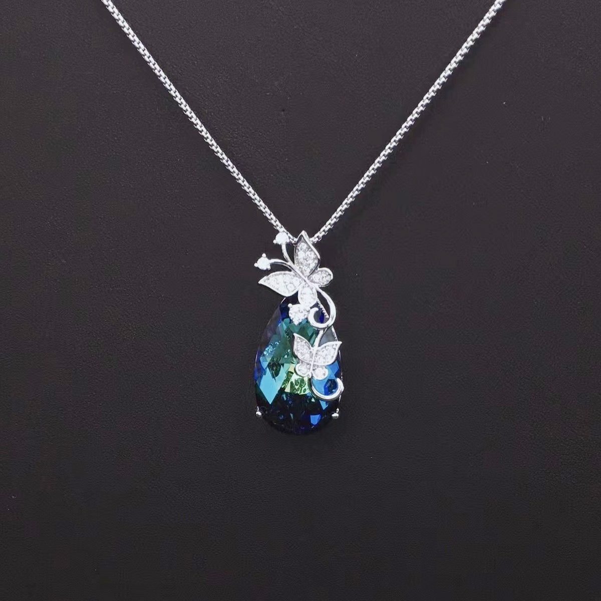 Sparkling Aqua Blue Gemstone Necklace with Halo Design