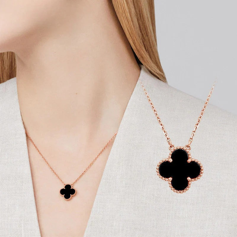 Black and white four-leaf clover necklace