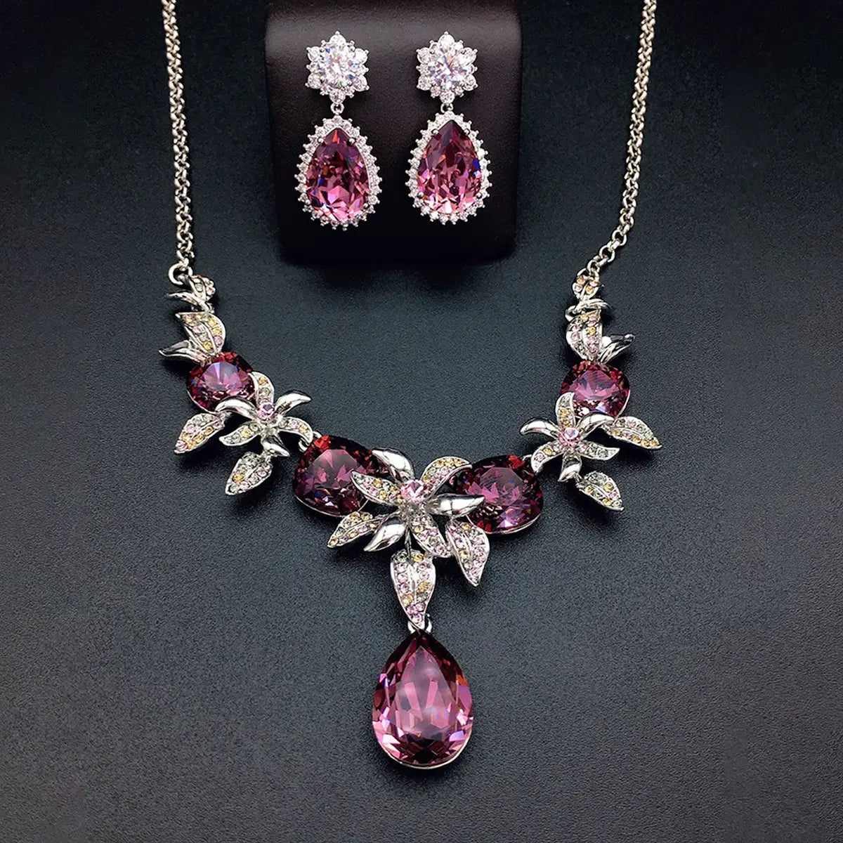 Parure collier et boucles d'oreilles fleur en cristal bleu de luxe