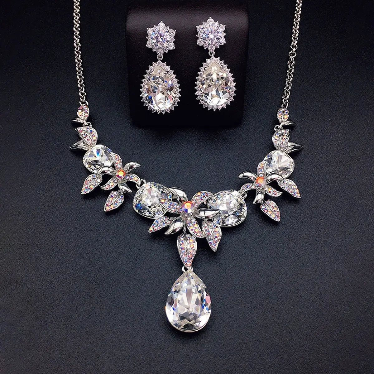 Parure collier et boucles d'oreilles fleur en cristal bleu de luxe