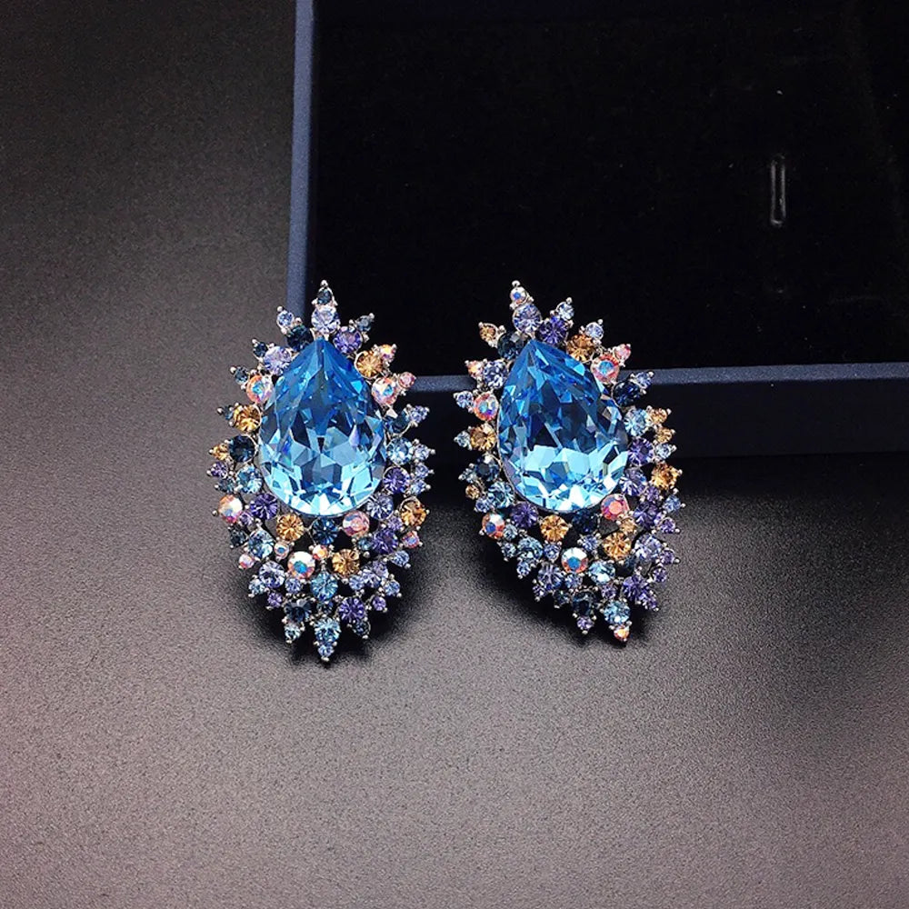 Boucles d'oreilles de luxe en cristal bleu roi avec halo céleste