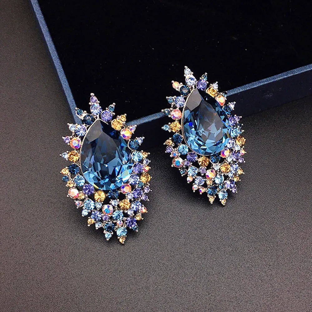 Boucles d'oreilles de luxe en cristal bleu roi avec halo céleste