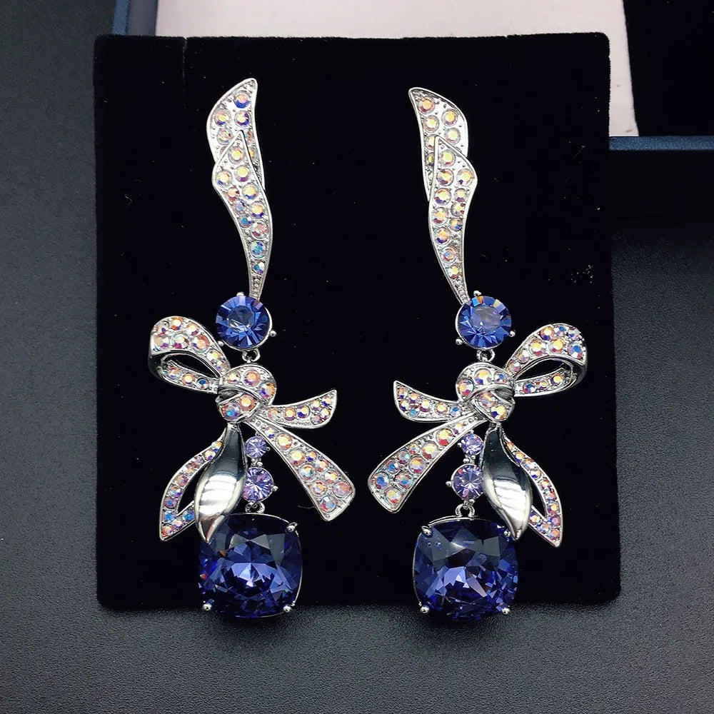 Élégantes boucles d'oreilles pendantes nœud en cristal bleu marine pour femme