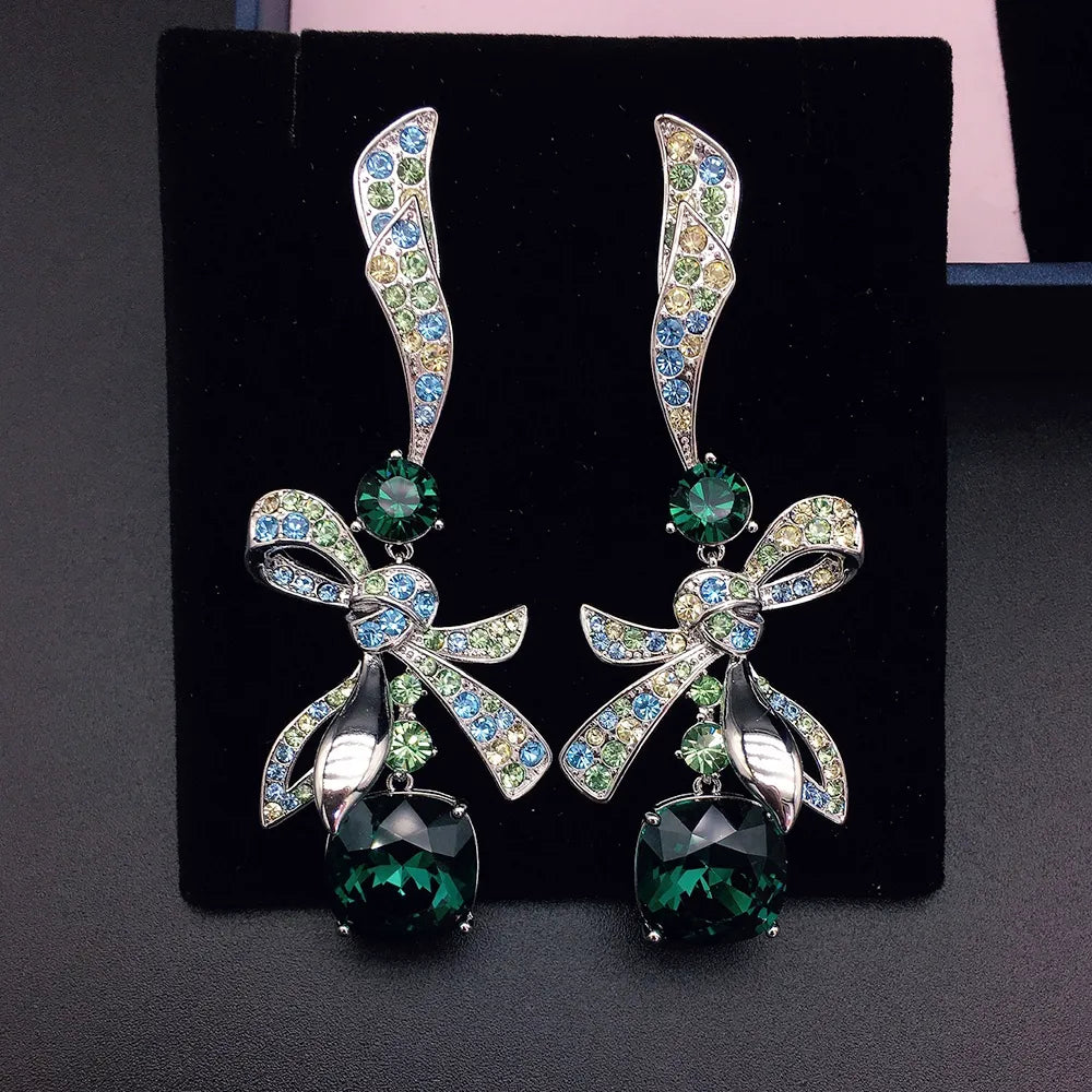 Élégantes boucles d'oreilles pendantes nœud en cristal bleu marine pour femme