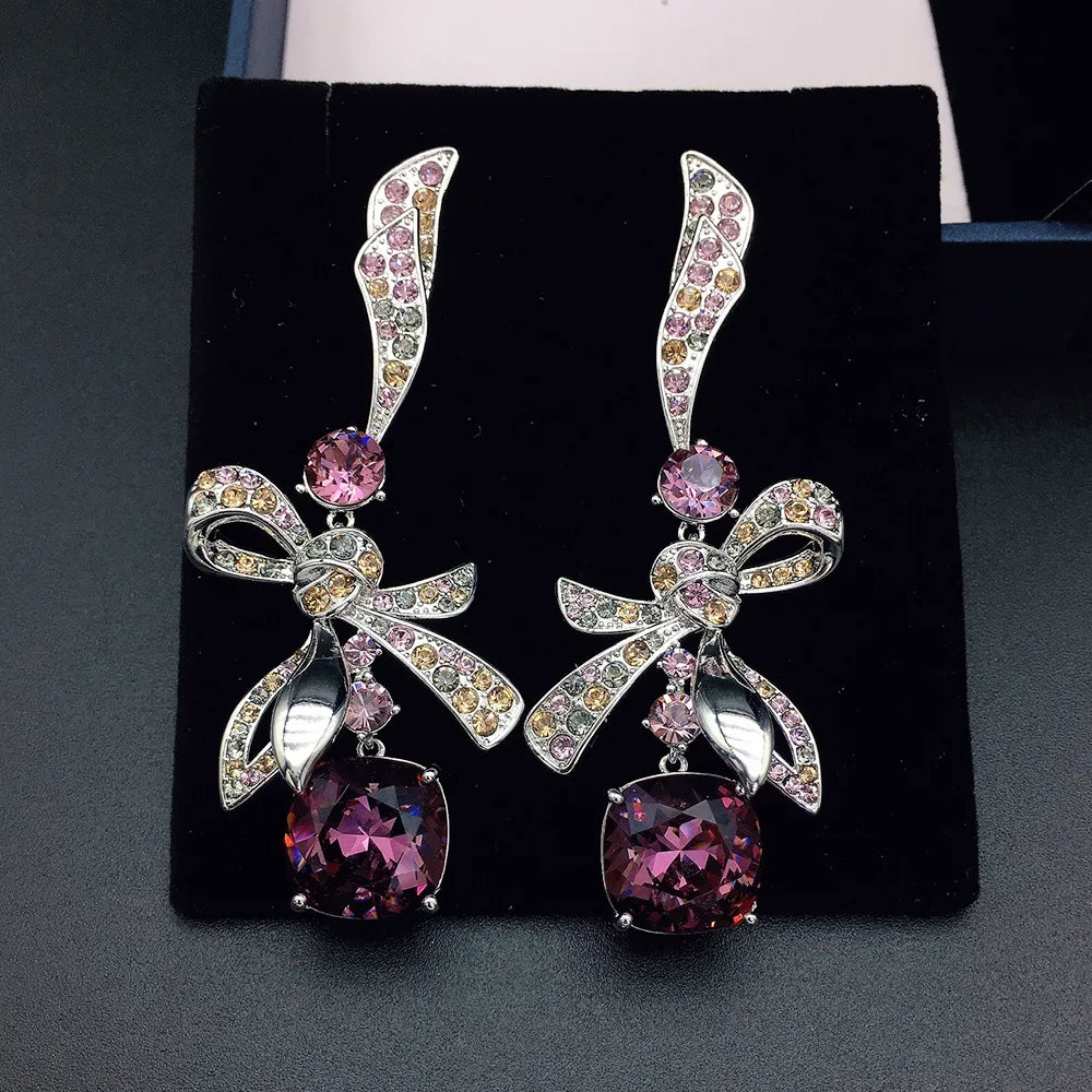 Élégantes boucles d'oreilles pendantes nœud en cristal bleu marine pour femme