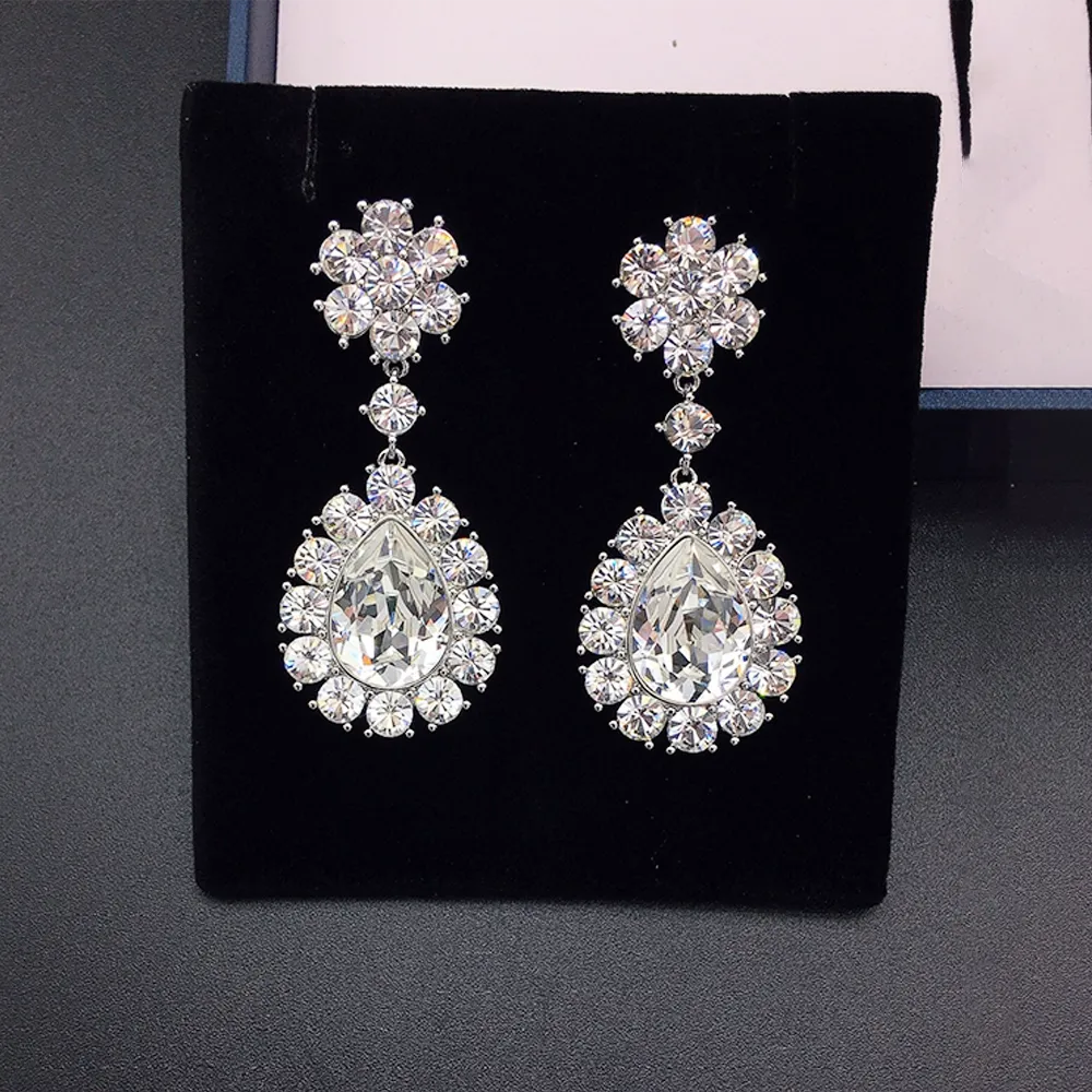 Boucles d'oreilles de luxe en cristal bleu en forme de goutte avec halo multicolore