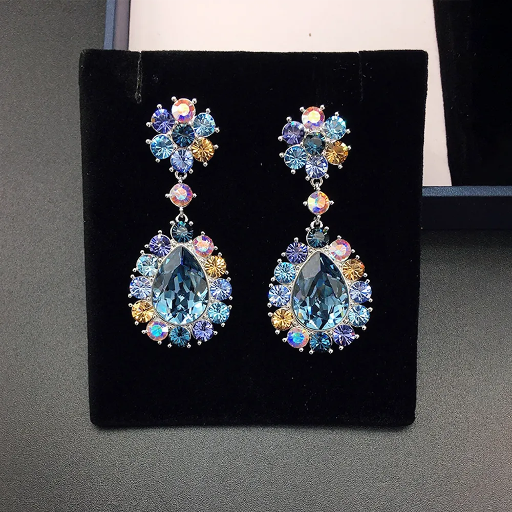 Boucles d'oreilles de luxe en cristal bleu en forme de goutte avec halo multicolore