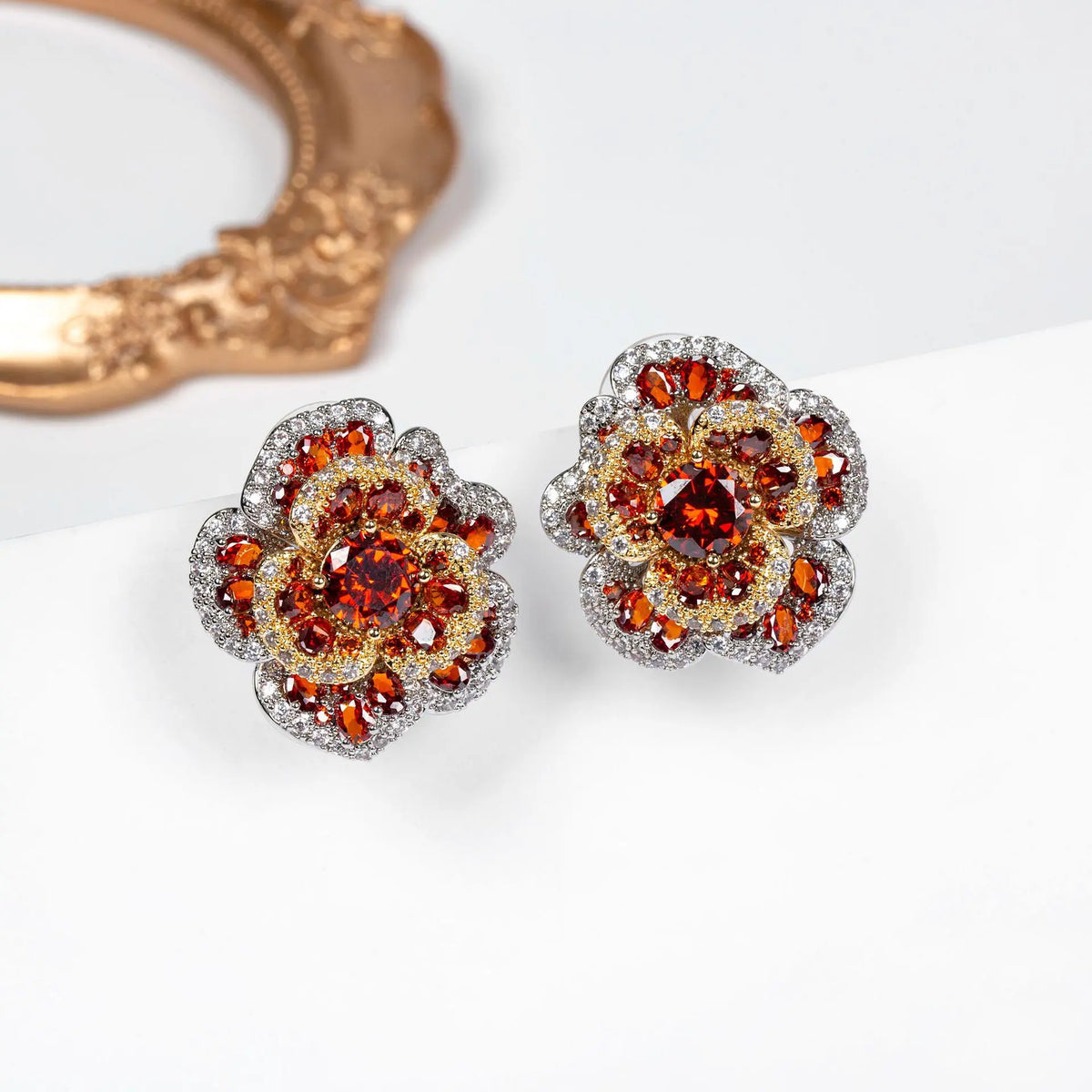 Boucles d'oreilles clous fleur en cristal rouge orangé de luxe