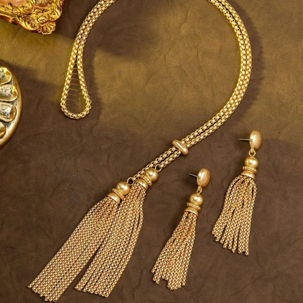 Parure collier et boucles d'oreilles femme pompon or de luxe