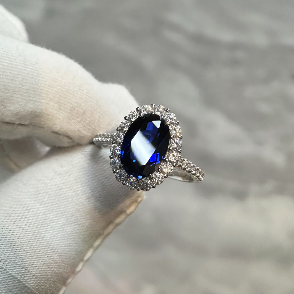 Bague de Fiançailles Ovale de Luxe Saphir Bleu Sertie d'un Halo