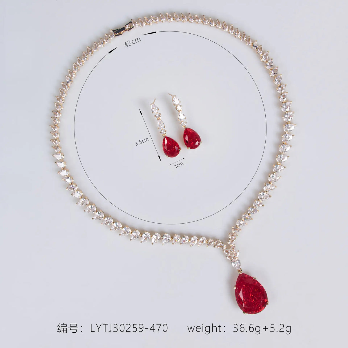 Parure collier et boucles d'oreilles goutte rubis luxe pour tenue de soirée