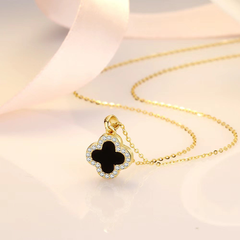 Black and white four-leaf clover necklace