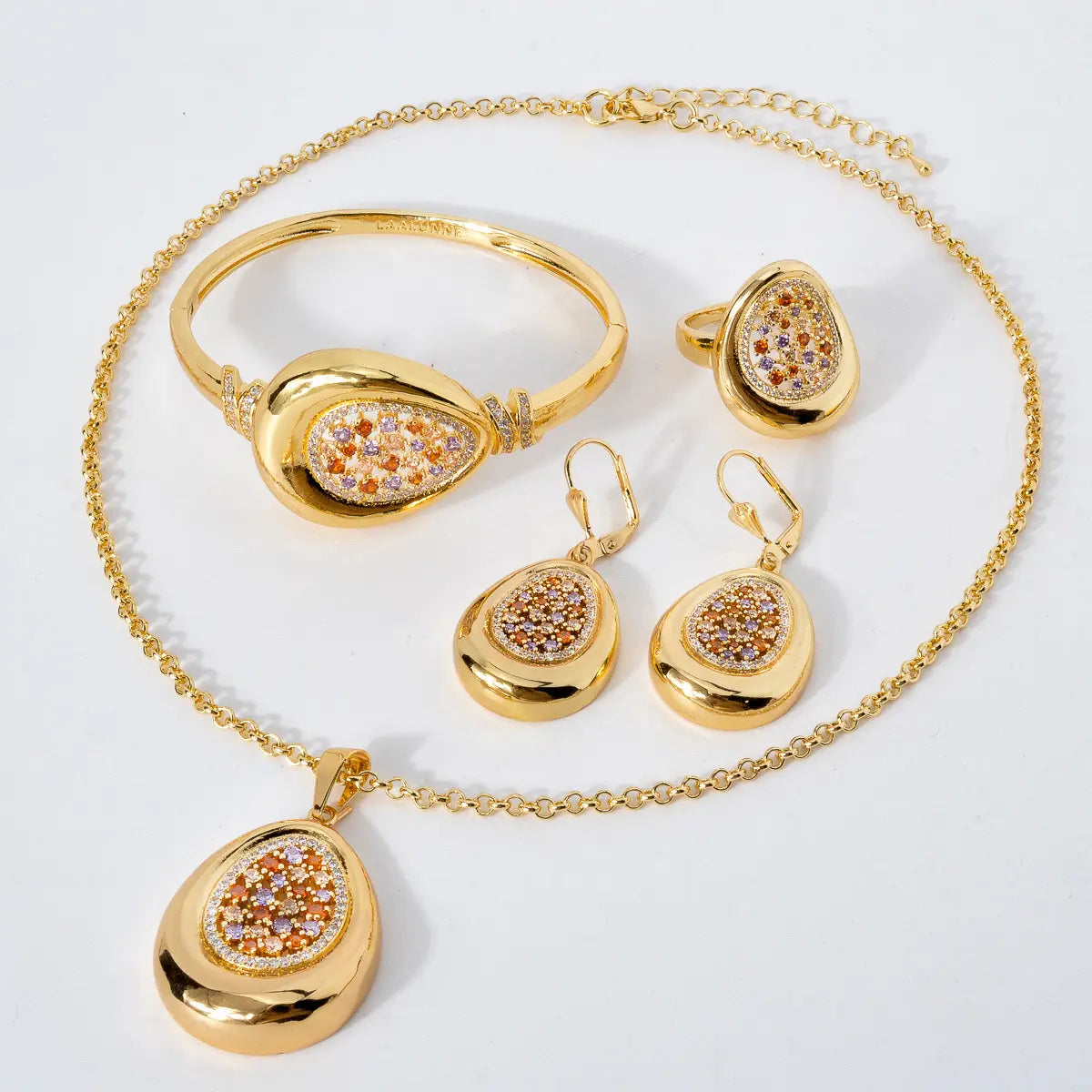 Pendentif goutte creux en diamant collier bracelet boucles d'oreilles bague ensemble de quatre pièces au design unique