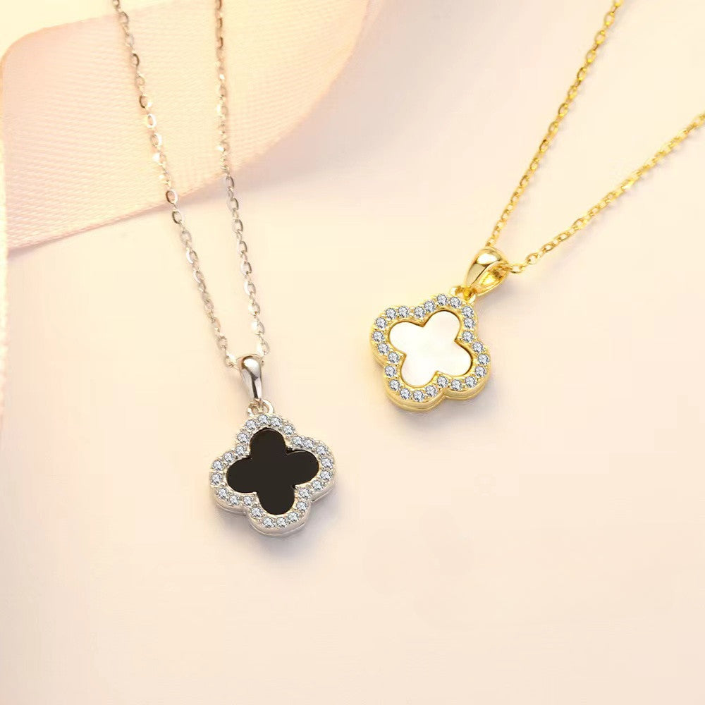 Black and white four-leaf clover necklace