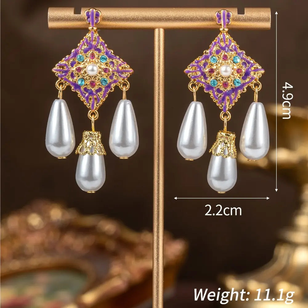 Parure collier et boucles d'oreilles nœud papillon, perles et pierres violettes de luxe