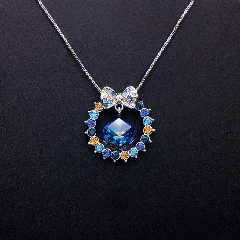 Elegant Bow - Accented Blue Crystal Wreath Necklace for Special Occasions