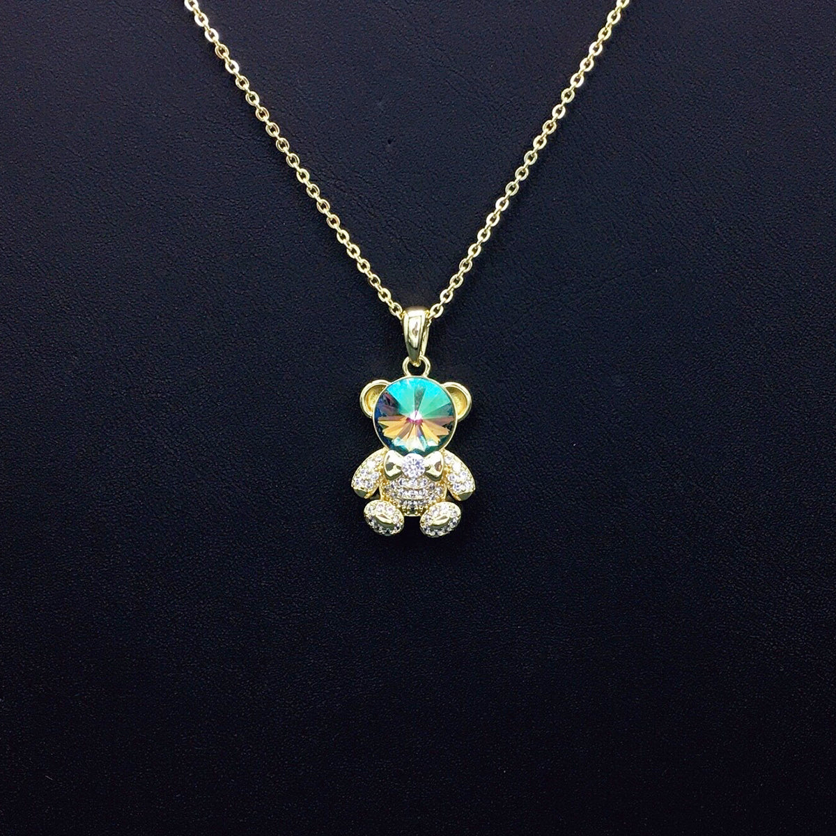 Delicate Gold Teddy Bear Necklace with Sparkling Blue Crystal as a Sweet Gift