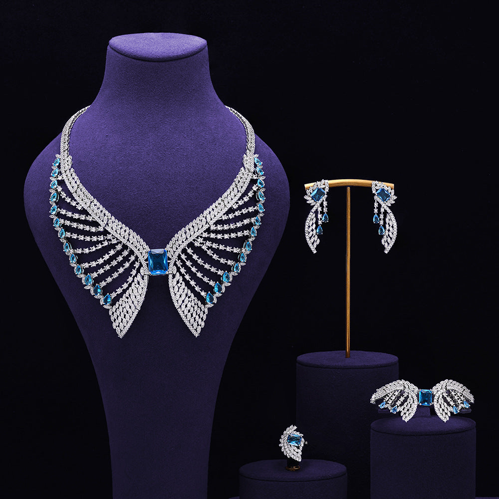 Parure de bijoux de mariée vert émeraude – Design de luxe inspiré des ailes