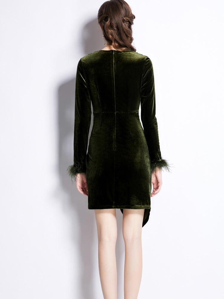 Green velvet long sleeved dress